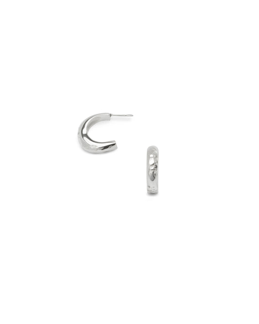 Sculptural textured sterling silver hoop earrings on a white background